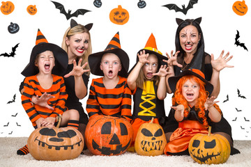 Children with moms celebrating Halloween.	
