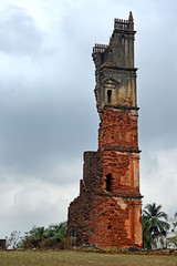 Fototapeta premium Ruins of 46 meter high belfry of the Church of St Augustine in Old Goa, India. Built by Augustinian friars and abandoned in 1835