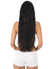 Obraz premium Female Long wavy brunette hair, rear view