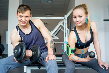 Fototapeta na wymiar Man and a girl at a gym