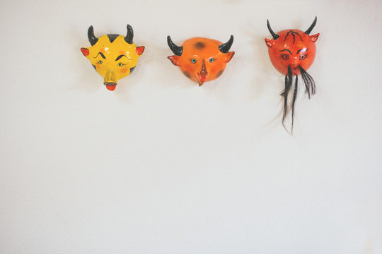devil masks as wall decor.