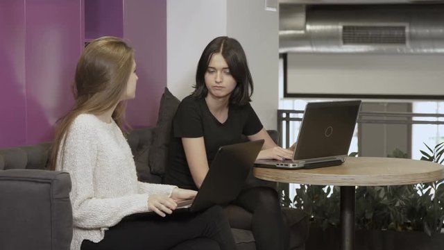 Young girls talks at the co-working space