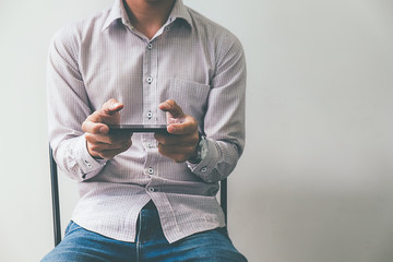Business process photo. Account manager using mobile phone. Typing contemporary smartphone screen.