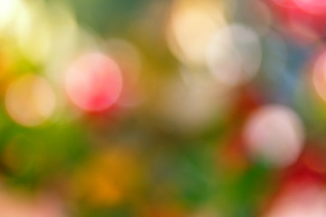 Festive  blur background. Abstract twinkled bright background with bokeh defocused blue, green, yellow and pink  lights. Christmas colorful blurred background