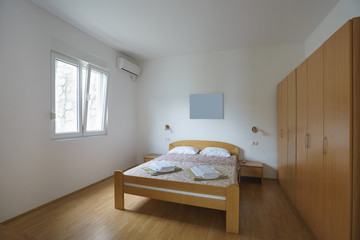 Fototapeta na wymiar Interior of a bedroom in a private villa