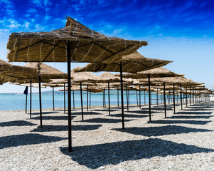 Horizontal vivid beach umbrellas background backdrop
