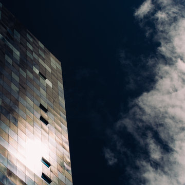 Open windows on a building with the sky as backdrop
