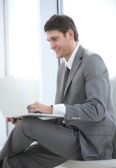 businessman talking on the Internet using a laptop