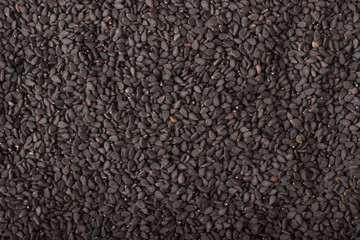 black sesame seeds spice as a background, natural seasoning texture