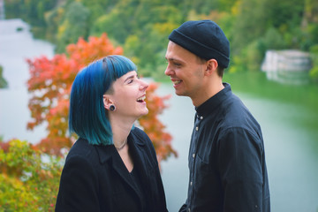 Young couple in black shirts smiling