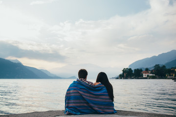 Couple wrapped in blanket