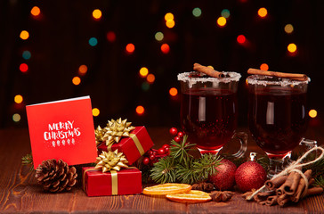 Glasses of mulled wine on wooden table