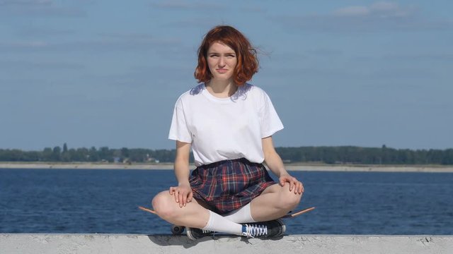 Young ginger girl showing fuck sign