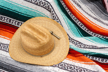Fototapeta premium Cowboy Hat on Mexican Striped Blanket