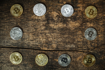 Many golden and silver bitcoins on a wooden surface, background with vintage effect, cryptocurrency concept for business idea, closeup, set