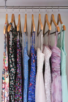 Selection Of Cute Summer Dresses Hanging In A Wardrobe