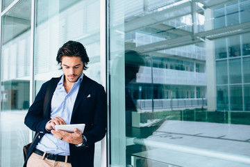 Young business man using digital tablet