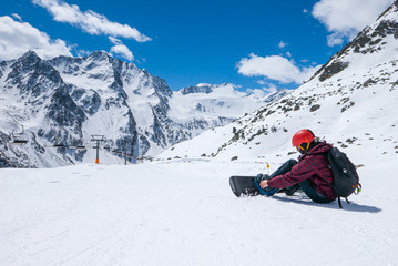 Snowboarder preparing for snowboarding