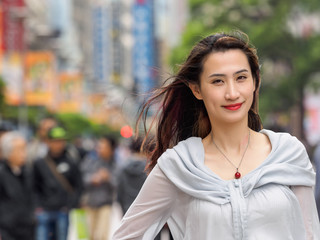 Beautiful woman walking on Nanjing road in Shanghai.