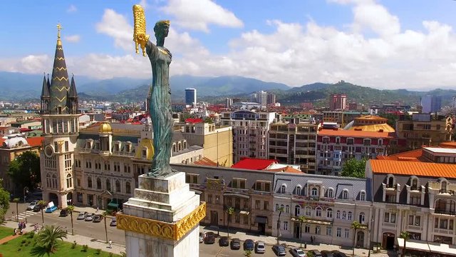 Monument to Medea in Europe Square in Batumi Georgia against cityscape, aerial 