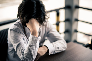 business man is stressed from his work. depression and anxiety concept.