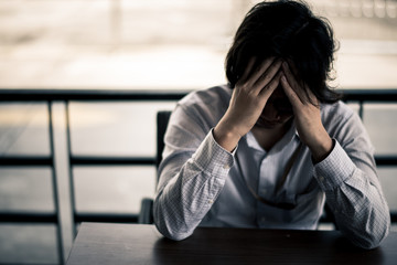 business man is stressed from his work. depression and anxiety concept.