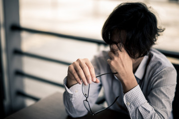 business man is stressed from his work. depression and anxiety concept.