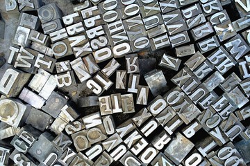 Old antique metal printing letters from a printing press