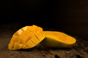 mango on a dark wood background