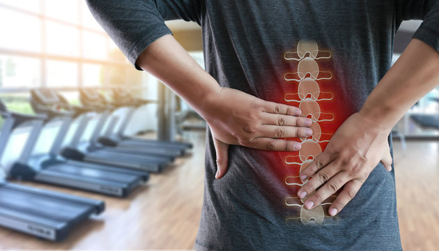 young man Feeling suffering  Lower back pain  Pain relief concept
