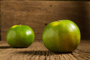 tangerine. sweet orange. on wooden. texture wooden