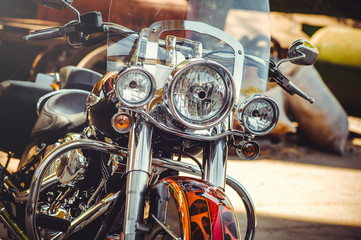 headlamps of a classic motorcycle, beautiful artistic processing for flyer calendar and advertising