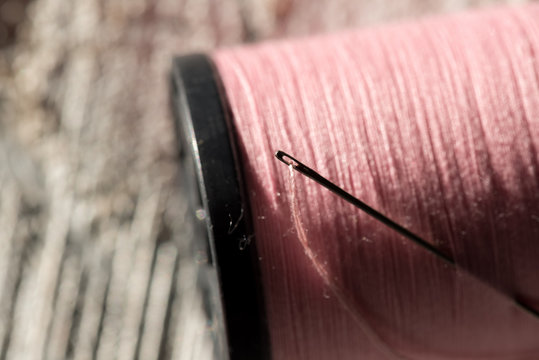 Needle and Thread in Spool of Thread