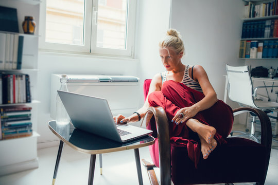 Caucasian Woman Surfing the Internet at Home