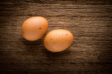 eggs on old wooden dark brown table