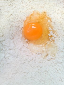 Egg with heart symbol in flour