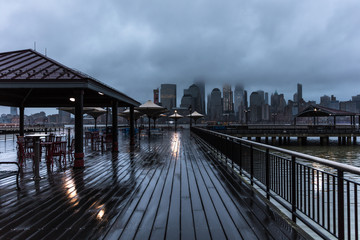 Wet Boardwalk. Sunrise. 2 Exchange Place. NYC Skyline. Cafe