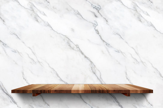 Empty wood plank shelf at white marble wall background,Mock up for display or montage of product or design.