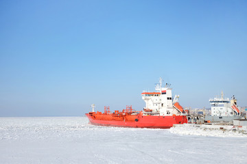 Red expedition ship in the ice