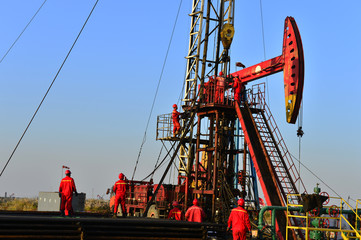 field oil workers at work