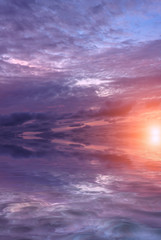 A dawn in the early morning and the first rays of the sun over the sea.