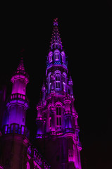 Fototapeta na wymiar Pink and Purple Illuminated Church Steeple at Night