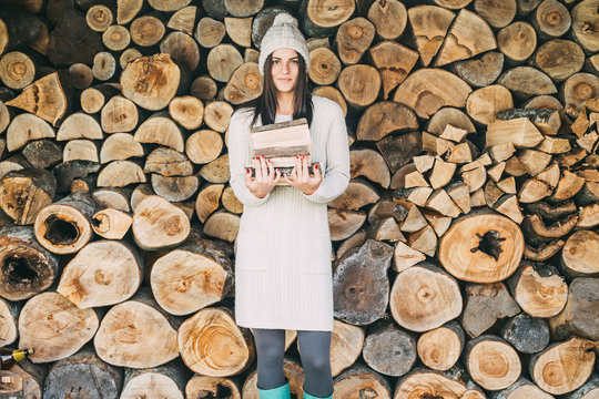 Woman holding chopped wood