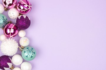 Modern pastel Christmas bauble side border over a light purple background