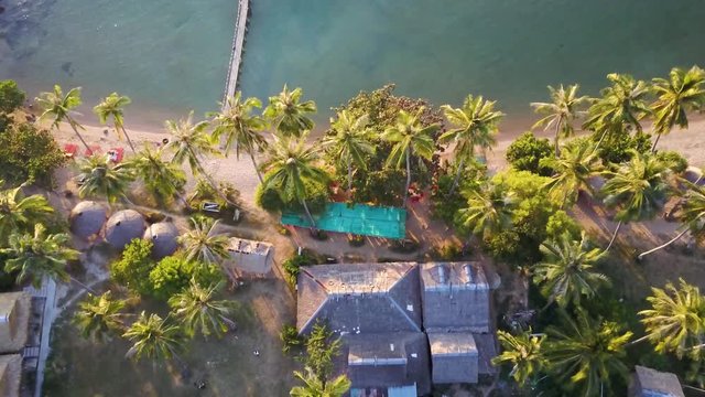 Camera descends on a village in paradise.