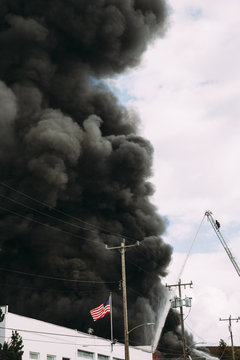 Smoke and flames rise into sky from 5-alarm fire, Seattle, WA