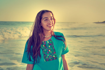 Latin beautiful girl in Caribbean beach sunset