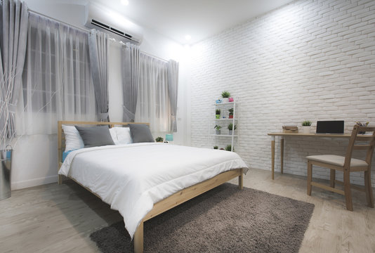 Stylish designed boy teenager's bedroom with white walls