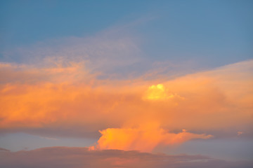 Sunset sky orange clouds on blue