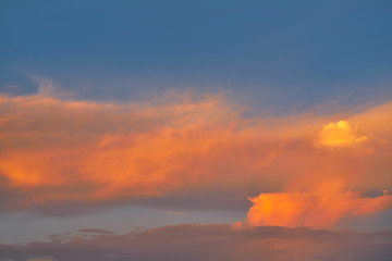 Sunset sky orange clouds on blue
